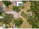 An overhead view displays the home’s setting with ample lot space and swimming pool at 1712 Fessler St, Englewood, FL 34223