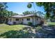 The backyard features lush greenery and a well-maintained lawn at 1712 Fessler St, Englewood, FL 34223