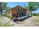 Charming home with a screened lanai and colorful landscaping at 1712 Fessler St, Englewood, FL 34223