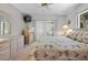 Bright bedroom with a ceiling fan, sliding doors, and neutral decor, creating a cozy and relaxing space at 1712 Fessler St, Englewood, FL 34223
