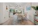 Bright dining room with view into living room, showcasing a marble table and comfortable seating at 1712 Fessler St, Englewood, FL 34223