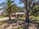 Charming single-story home surrounded by mature landscaping at 1712 Fessler St, Englewood, FL 34223