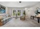 Bright living room featuring neutral decor, large windows, and comfortable furnishings, creating a serene atmosphere at 1712 Fessler St, Englewood, FL 34223
