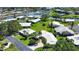 Aerial view of a home with a well-maintained yard near a waterfront community at 19 Oakwood Dr N # 19, Englewood, FL 34223