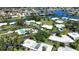 Aerial view of a waterfront community with a community pool at 19 Oakwood Dr N # 19, Englewood, FL 34223
