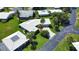 Aerial view of a single Gathering home and lush landscaped yard at 19 Oakwood Dr N # 19, Englewood, FL 34223