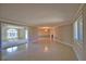 Open concept living space featuring sleek, polished floors and neutral wall colors at 19 Oakwood Dr N # 19, Englewood, FL 34223