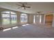 Bright and airy living room featuring large windows and recessed lighting at 19 Oakwood Dr N # 19, Englewood, FL 34223
