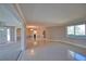 Open concept living space with light-colored walls and sleek, polished floors at 19 Oakwood Dr N # 19, Englewood, FL 34223