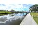 Picturesque waterfront view with boat docks and calm water reflecting the sky at 19 Oakwood Dr N # 19, Englewood, FL 34223