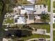 Aerial view of the property featuring a pool, boat dock, and ample parking at 2060 Oyster Creek Dr, Englewood, FL 34224