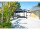 An outdoor entertaining space featuring a large pavilion structure set in a well-maintained backyard at 2060 Oyster Creek Dr, Englewood, FL 34224