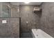 Well designed bathroom features granite tiling, a sleek shower and modern fixtures at 2060 Oyster Creek Dr, Englewood, FL 34224