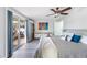Bright and airy bedroom with hardwood flooring and sliding glass door to deck at 2060 Oyster Creek Dr, Englewood, FL 34224