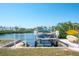 Boat lift with a pontoon boat and jet ski ready for your next water adventure at 2060 Oyster Creek Dr, Englewood, FL 34224