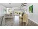 Open-concept dining area with bar seating and backyard views, creating an inviting space for meals and gatherings at 2060 Oyster Creek Dr, Englewood, FL 34224