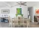Cozy dining room with modern decor, beautiful artwork, and a seamless transition to the living area at 2060 Oyster Creek Dr, Englewood, FL 34224
