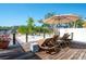 A peaceful deck with comfortable seating provides a scenic view of the surrounding nature and water at 2060 Oyster Creek Dr, Englewood, FL 34224