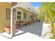 Charming outdoor seating area with a bench, swing, and decorative accents, creating a welcoming entrance at 2060 Oyster Creek Dr, Englewood, FL 34224