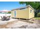 A charming backyard studio with outdoor dining area and a patio umbrella for outdoor enjoyment at 2060 Oyster Creek Dr, Englewood, FL 34224
