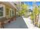 Covered patio with comfortable seating, decorative accents, and a tranquil outdoor space at 2060 Oyster Creek Dr, Englewood, FL 34224