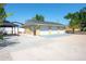 Spacious detached three-car garage with ample parking space and a convenient covered gazebo at 2060 Oyster Creek Dr, Englewood, FL 34224