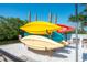 Colorful kayaks are racked on a canal-front property at 2060 Oyster Creek Dr, Englewood, FL 34224