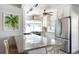 Bright, modern kitchen with stainless steel appliances, white cabinets, and a sleek countertop at 2060 Oyster Creek Dr, Englewood, FL 34224