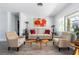 Cozy living room featuring comfortable seating, decorative accents, and ample natural light at 2060 Oyster Creek Dr, Englewood, FL 34224