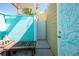 Outdoor shower with seating area and colorful decor at 2060 Oyster Creek Dr, Englewood, FL 34224