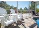 Relax in comfort in these poolside chairs with a beautiful view of the well-manicured landscaping at 2060 Oyster Creek Dr, Englewood, FL 34224