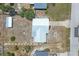 Aerial view of the property showcasing the house, large backyard, detached shed, and the neighborhood layout at 2117 Michigan Ave, Englewood, FL 34224