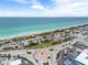 An aerial view of a beach with the road that runs along the beach and a roundabout at 2117 Michigan Ave, Englewood, FL 34224