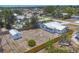 Bird's-eye view of a home with a large yard, storage shed and surrounding residential area from a high vantage point at 2117 Michigan Ave, Englewood, FL 34224