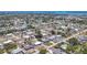 Aerial view of a quaint neighborhood with neatly arranged single-Gathering homes and tree-lined streets in a sunny locale at 2117 Michigan Ave, Englewood, FL 34224