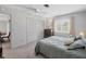 Comfortable bedroom featuring a ceiling fan, closet, and a bright window at 2117 Michigan Ave, Englewood, FL 34224