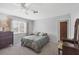 Cozy bedroom featuring neutral decor, a large window for ample natural light, and a comfortable-sized bed at 2117 Michigan Ave, Englewood, FL 34224
