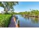 Exterior view of a wooden boat dock along the water with room to moor several boats at 2117 Michigan Ave, Englewood, FL 34224