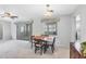 Light-filled dining area features a modern ceiling fan and natural light, perfect for meals and gatherings at 2117 Michigan Ave, Englewood, FL 34224