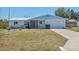 Charming single-story home with a well-maintained front yard, and a one-car garage at 2117 Michigan Ave, Englewood, FL 34224