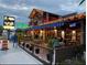 Inviting outdoor restaurant featuring ample seating and festive lighting for a delightful dining experience at 2117 Michigan Ave, Englewood, FL 34224