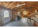 Spacious shed with wooden walls, shelves, and a workbench, ideal for hobbies, storage, or a workshop at 2117 Michigan Ave, Englewood, FL 34224