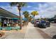 Charming sidewalk cafe view with tables, umbrellas, and chairs, perfect for enjoying the outdoors in Englewood at 2117 Michigan Ave, Englewood, FL 34224