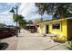 A vibrant storefront of local businesses along a sunny street, showcasing a lively and walkable downtown area at 2117 Michigan Ave, Englewood, FL 34224