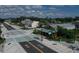 Street view featuring well-maintained crosswalk, bike lane, and quaint local shops under a sunny sky at 2117 Michigan Ave, Englewood, FL 34224