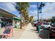 Street view of shops featuring awnings, sidewalks, and street parking at 2117 Michigan Ave, Englewood, FL 34224