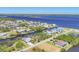 Aerial view showing a waterfront neighborhood with access to open bay waters at 2441 Vance Ter, Port Charlotte, FL 33981