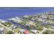 Aerial view showcasing waterfront homes with canal access to the bay at 2441 Vance Ter, Port Charlotte, FL 33981