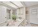 Clean bathroom with double vanity, tiled shower, and ample storage at 2441 Vance Ter, Port Charlotte, FL 33981
