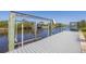 Dock with boat lift on the water provides easy access to boating at 2441 Vance Ter, Port Charlotte, FL 33981